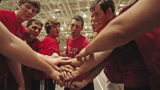 group of students standing in circle 